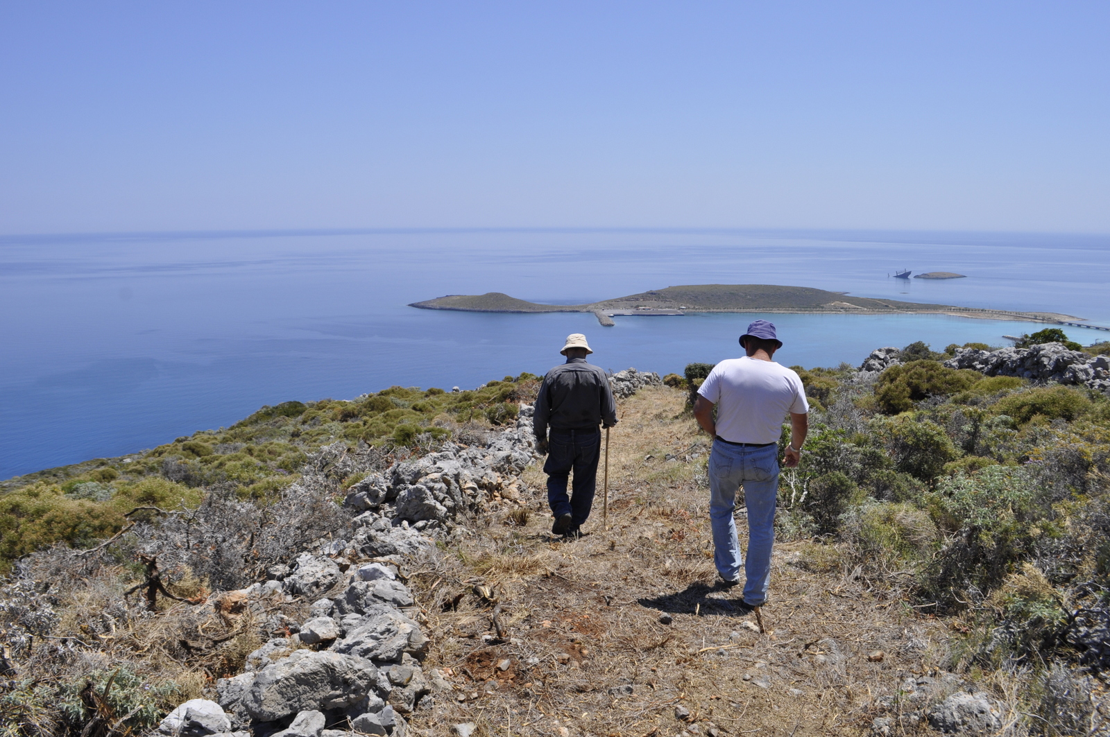 People hiking on a trail near Diakofti, on the island of Kythera