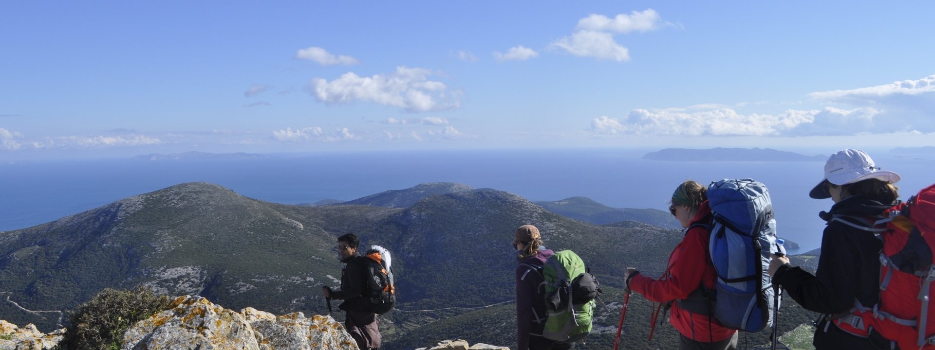 Hikers on the summit of Sinfos island, Greece